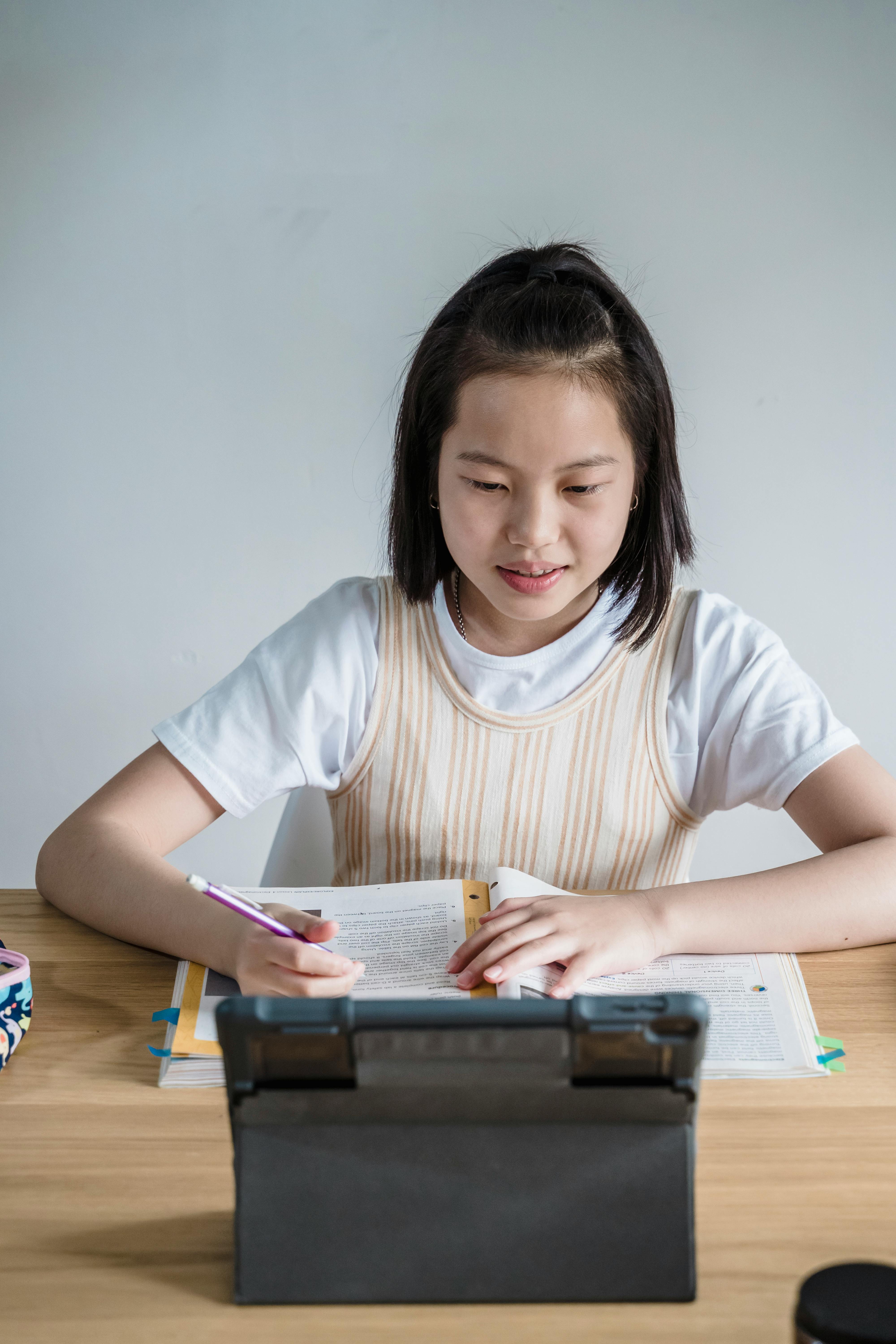 Secondary-age students collaborating with technology in a learning studio. Photo: Annushka Ahuja / Pexels.